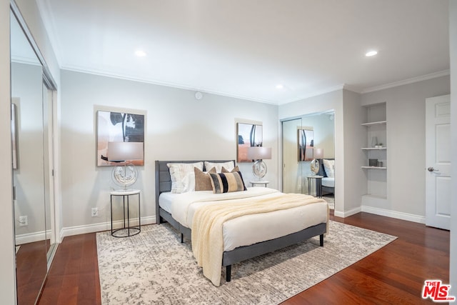 bedroom with wood-type flooring and crown molding