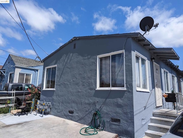 view of property exterior featuring a patio area