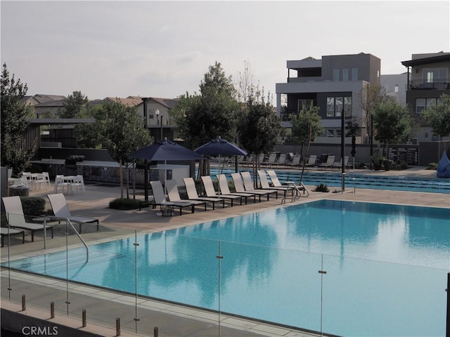 view of swimming pool with a patio area