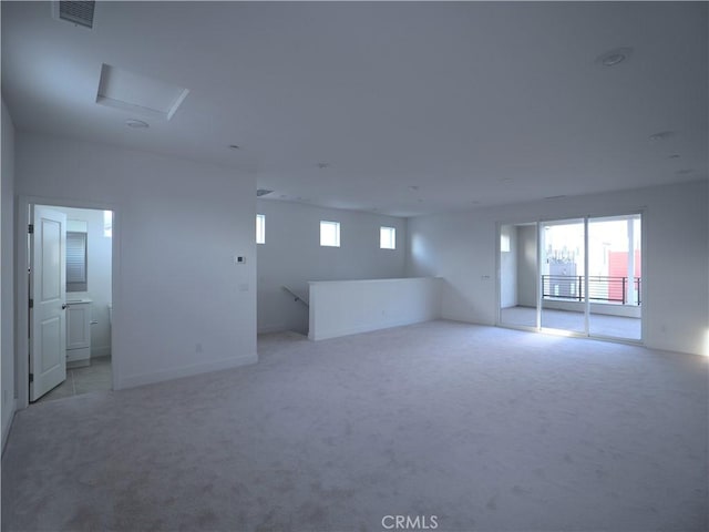 unfurnished room with light carpet and a healthy amount of sunlight