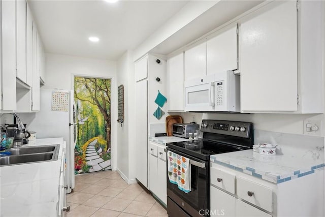 kitchen with sink, light tile patterned flooring, white cabinetry, stainless steel range with electric cooktop, and light stone counters