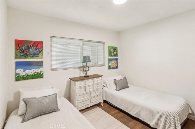 bedroom featuring dark hardwood / wood-style floors