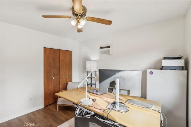 office space featuring ceiling fan, an AC wall unit, and hardwood / wood-style floors