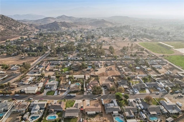 birds eye view of property featuring a mountain view