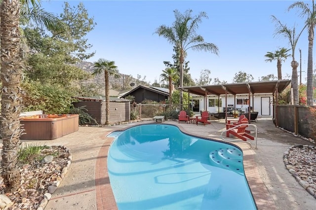 view of swimming pool featuring a patio area