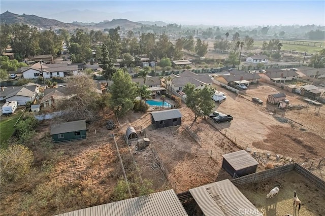 birds eye view of property with a mountain view