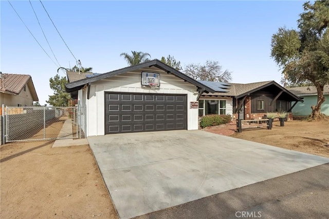 view of front of home featuring a garage and solar panels