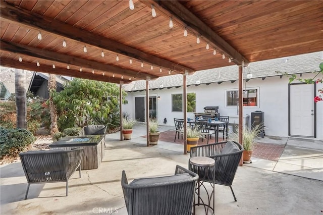 view of patio / terrace featuring an outdoor living space with a fire pit