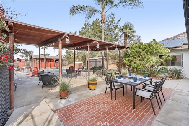 view of patio with a swimming pool