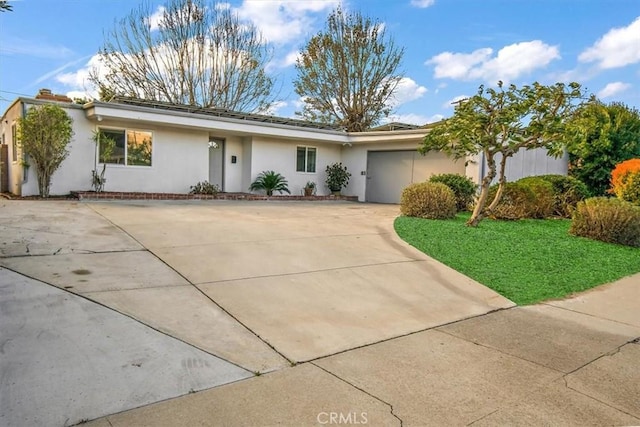 ranch-style home featuring a front yard