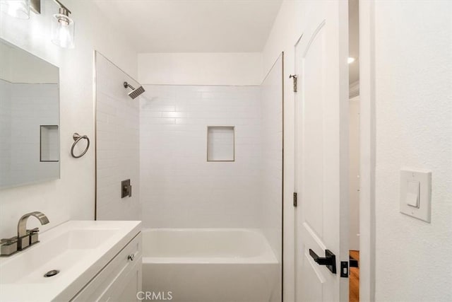 bathroom featuring tub / shower combination and vanity