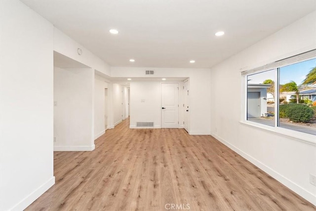 unfurnished room featuring light hardwood / wood-style floors