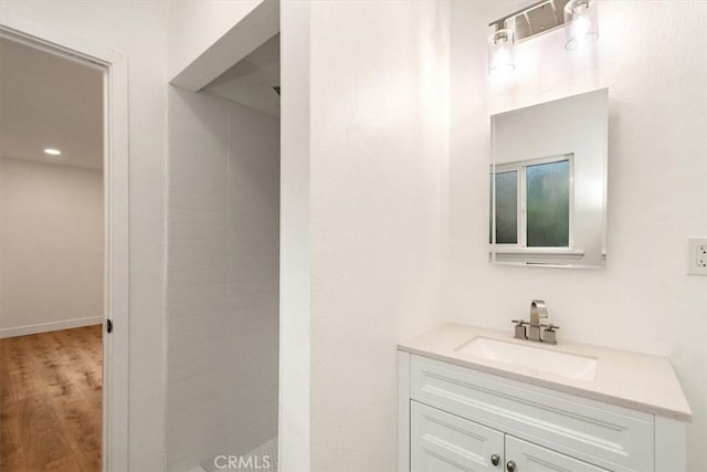 bathroom featuring wood-type flooring and vanity