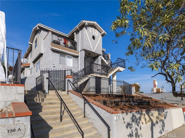 view of front of house with a balcony