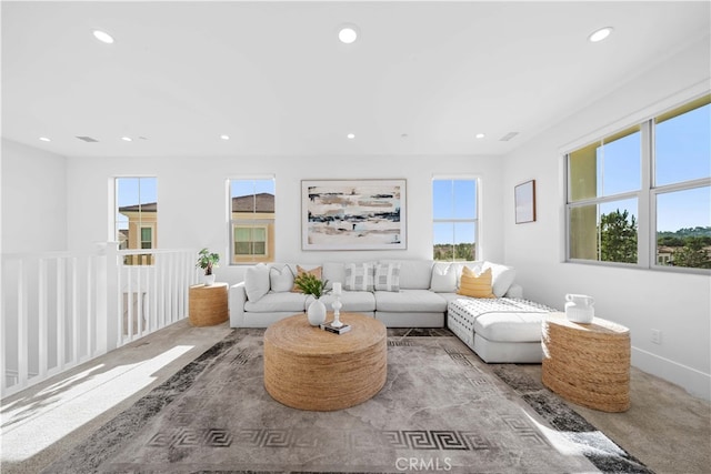 carpeted living room with recessed lighting