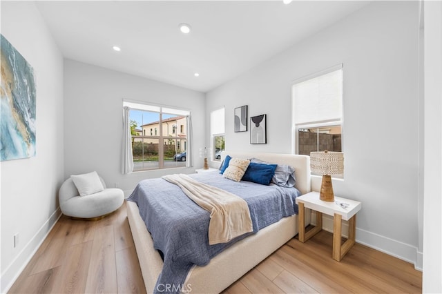 bedroom featuring recessed lighting, baseboards, and light wood finished floors