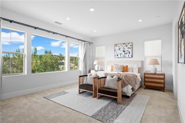 bedroom featuring recessed lighting, light carpet, and baseboards