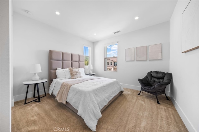 bedroom with carpet, visible vents, baseboards, and recessed lighting