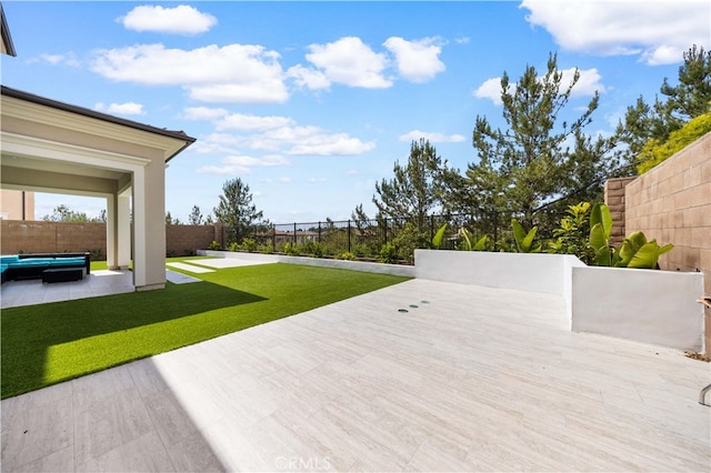 view of yard featuring a patio area and a fenced backyard