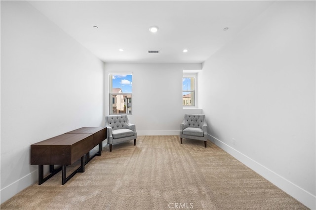 living area featuring recessed lighting, baseboards, visible vents, and carpet flooring