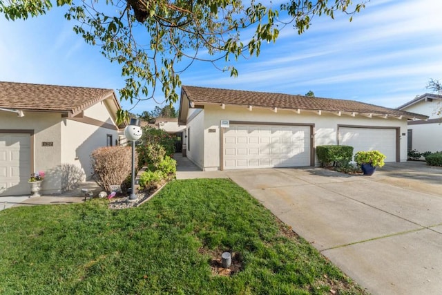 view of side of home with a garage and a lawn