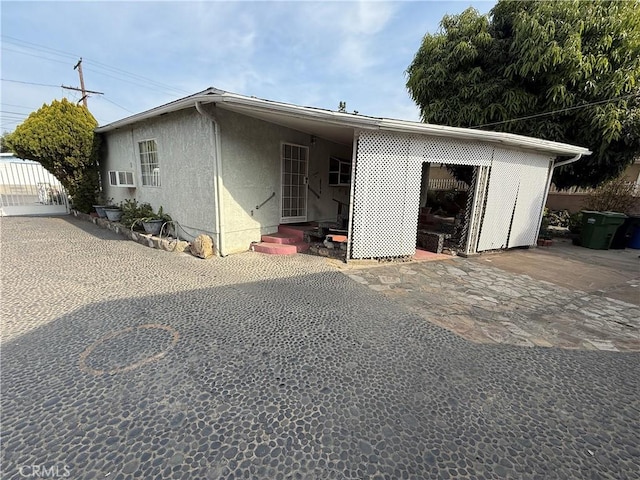 view of front facade with a carport and a garage