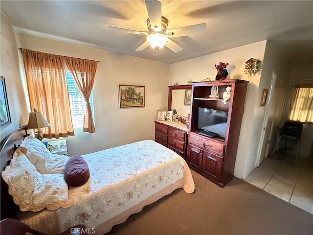 bedroom featuring ceiling fan and light tile patterned flooring