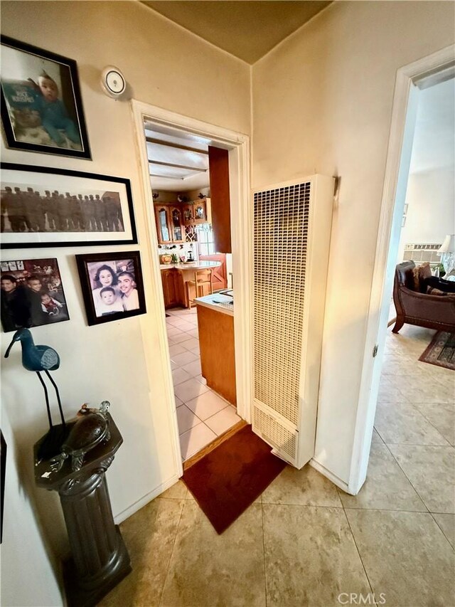 hallway featuring light tile patterned flooring