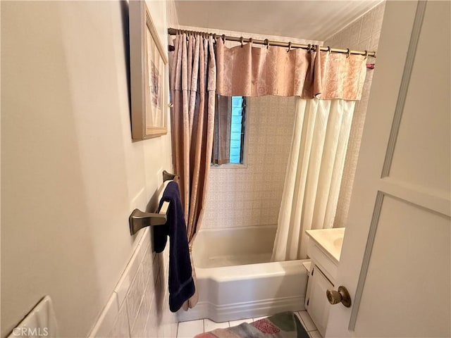 bathroom featuring shower / tub combo and vanity