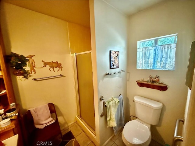 bathroom featuring toilet, tile patterned flooring, and walk in shower