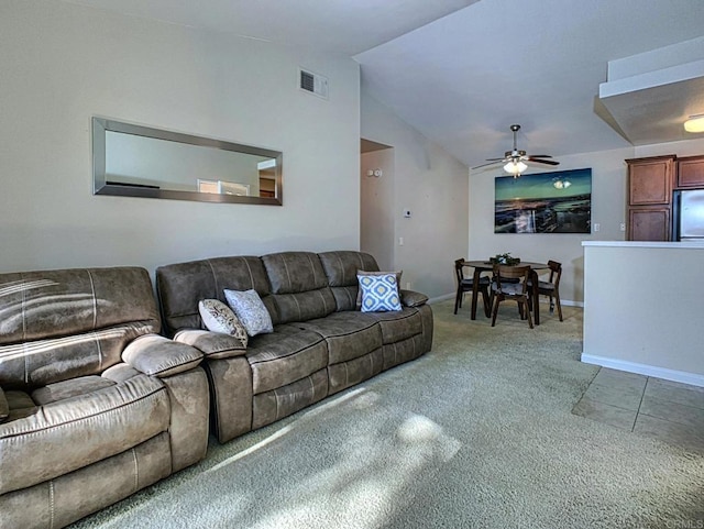 carpeted living room featuring lofted ceiling and ceiling fan