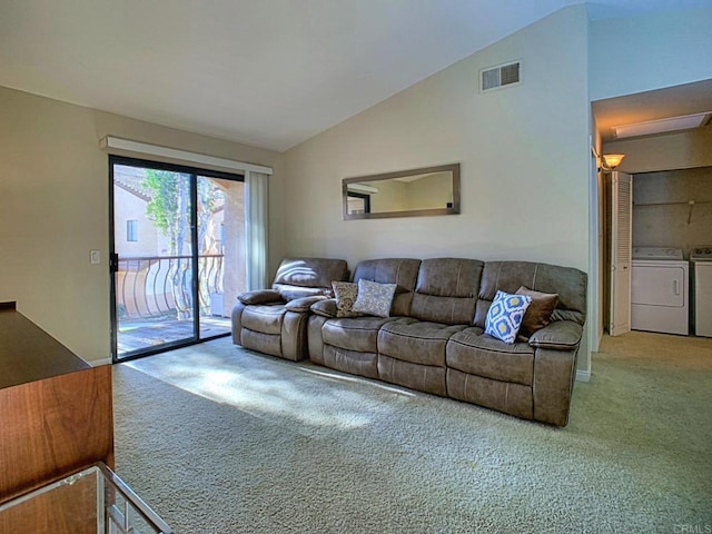 living room featuring high vaulted ceiling, carpet floors, and washing machine and dryer