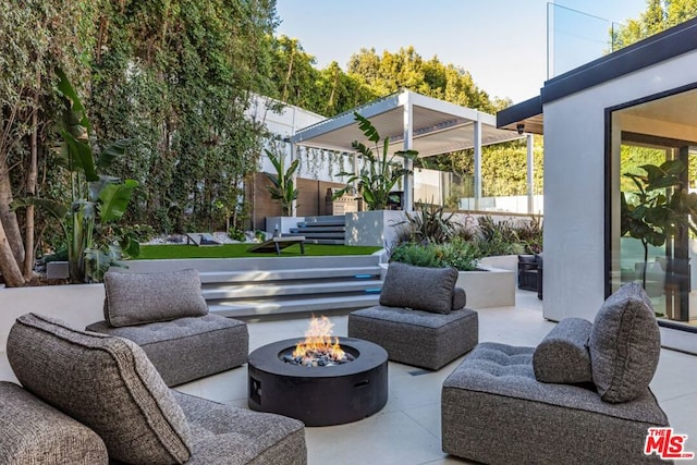 view of patio with an outdoor fire pit