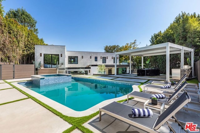 view of swimming pool featuring an in ground hot tub and a patio