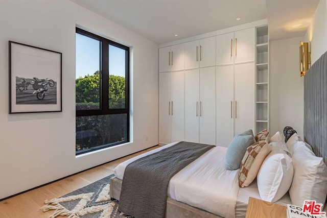 bedroom with light wood-type flooring