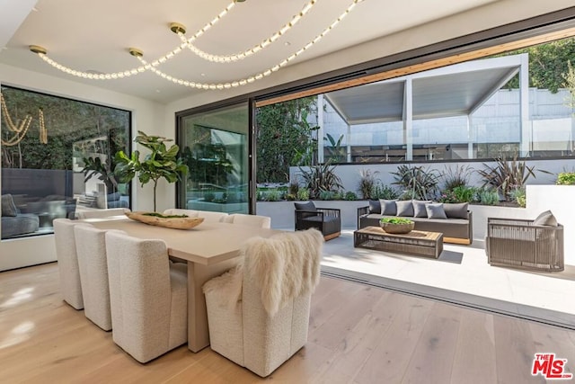 dining space with light wood-type flooring