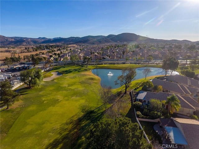 aerial view featuring a water and mountain view