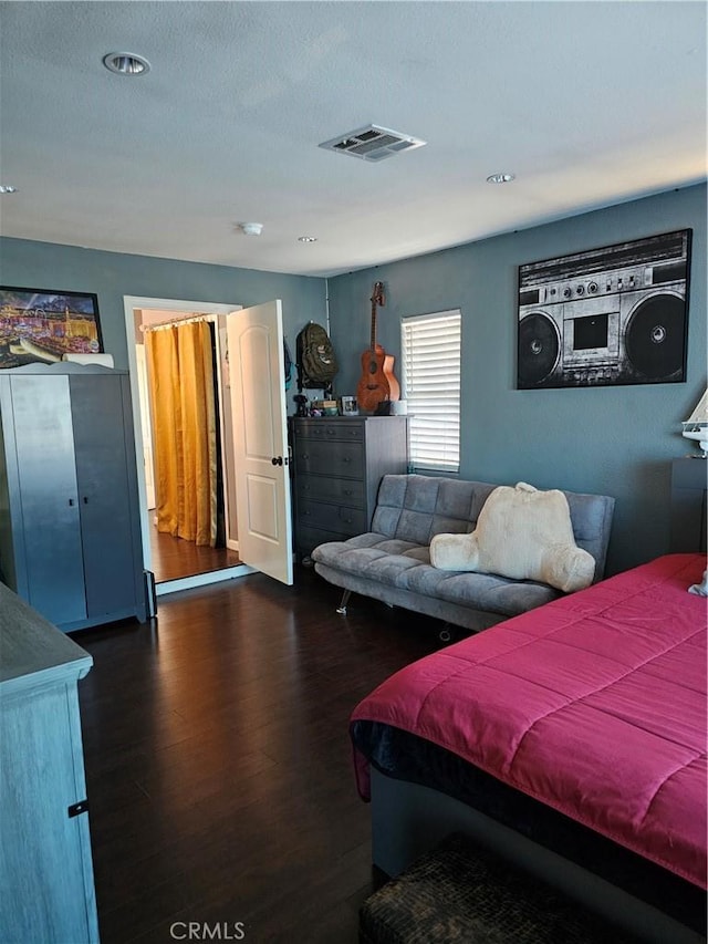 bedroom featuring dark hardwood / wood-style floors