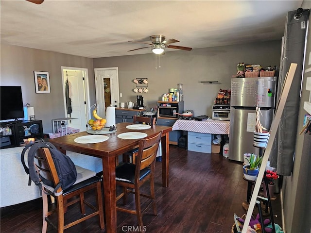 dining area with ceiling fan and dark hardwood / wood-style floors