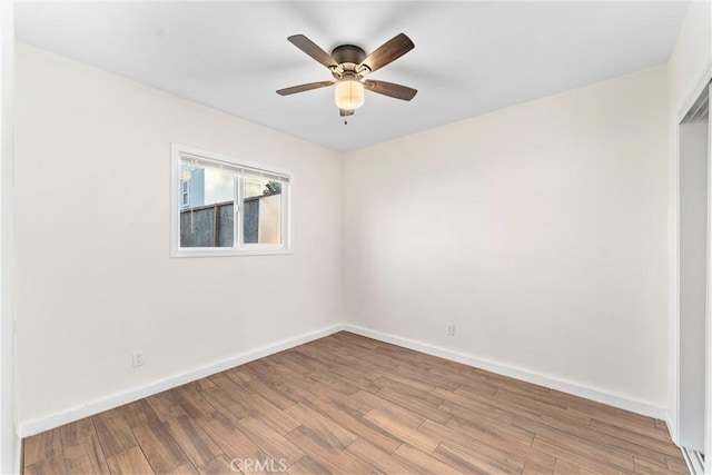 spare room with light hardwood / wood-style floors and ceiling fan