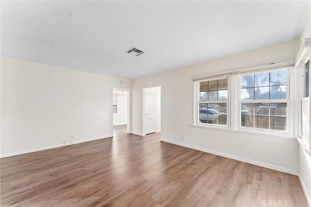 empty room with wood-type flooring