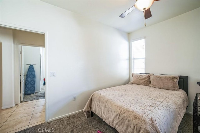 bedroom with ceiling fan and light carpet