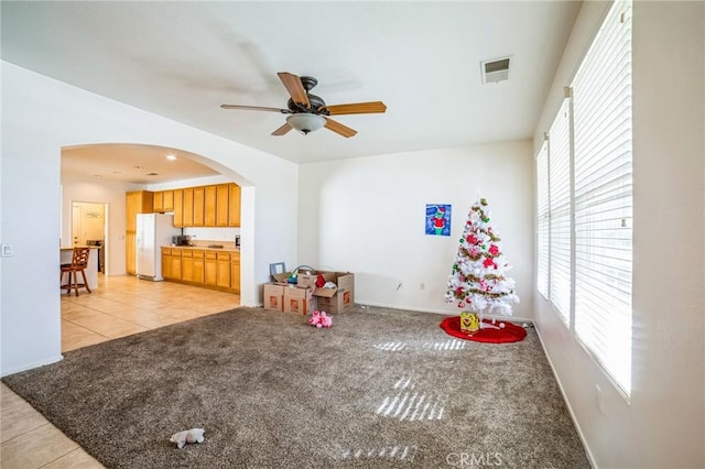 recreation room featuring ceiling fan and light tile patterned flooring