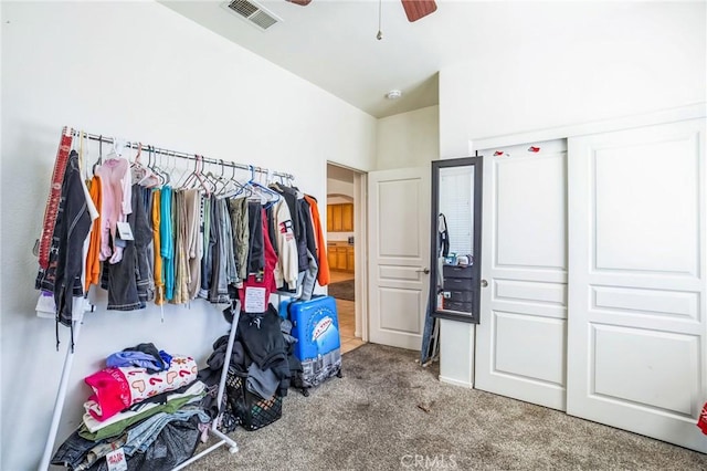 spacious closet with a ceiling fan, carpet, and visible vents