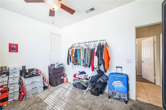 interior space with ceiling fan and carpet floors