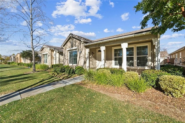 view of front facade with a front lawn and a porch