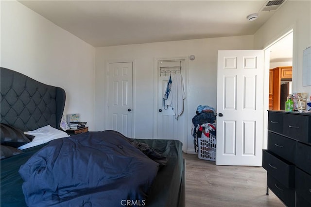 bedroom featuring light wood-type flooring