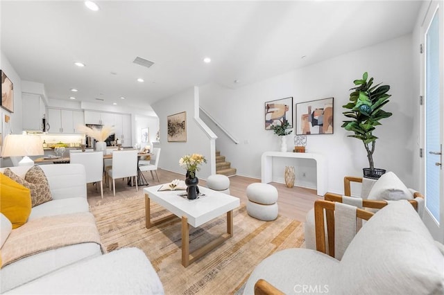 living room with light hardwood / wood-style floors