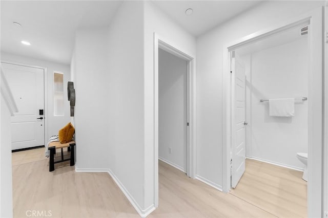 hall with light wood-type flooring