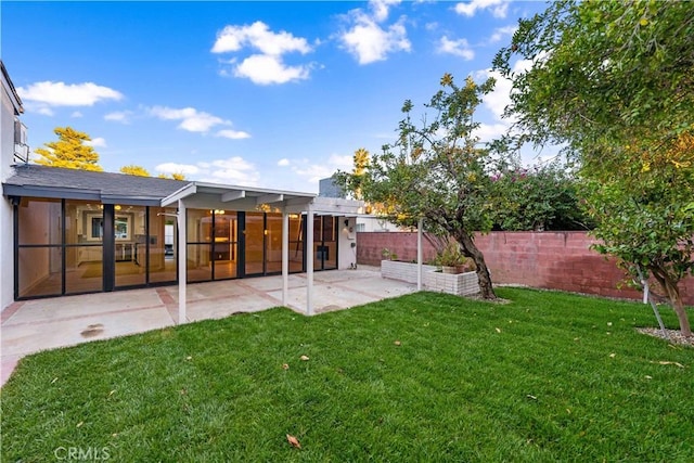 exterior space featuring a lawn and a patio